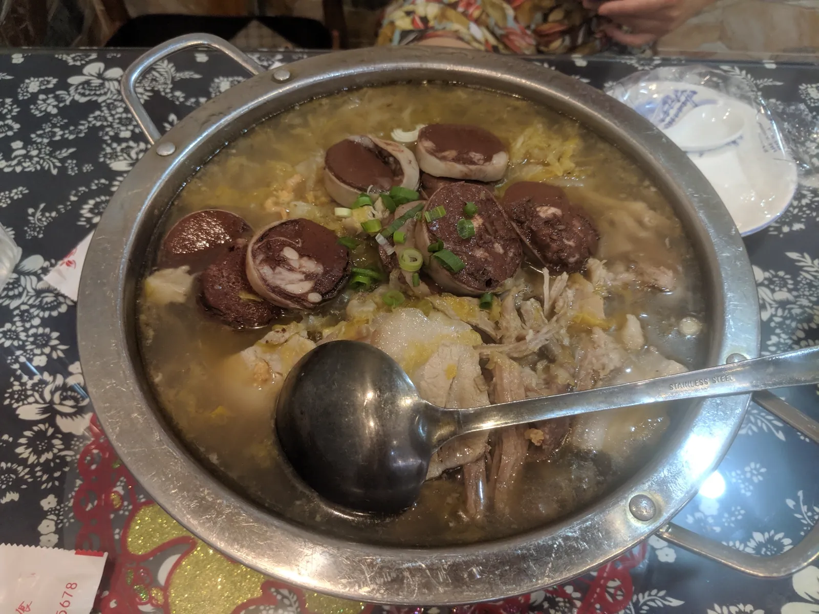 Suan cai stewed pork with blood sausage, the same trio that goes into the hotpot